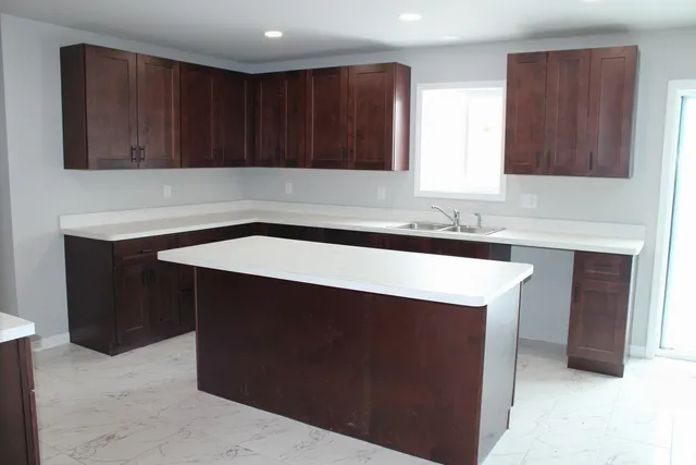 a kitchen with a sink and a cabinets