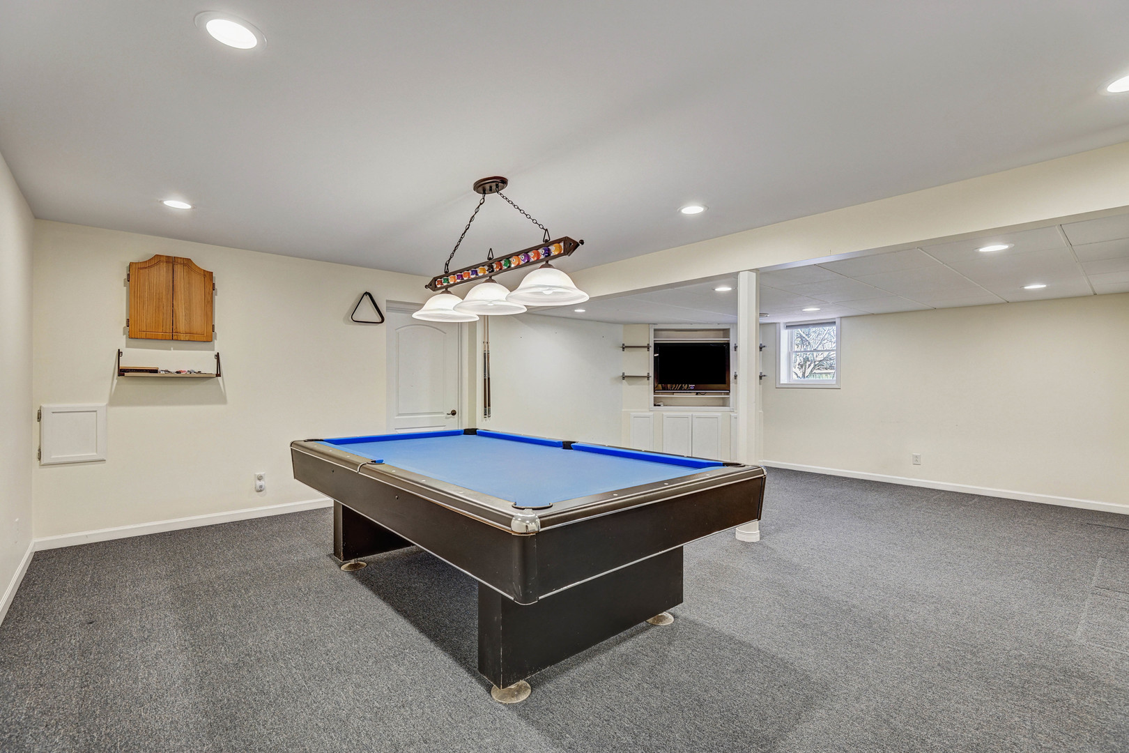 3901 Weathervane Lane Crystal Lake, IL 60012 - Photo 33 of 36 a room with pool table and a chandelier