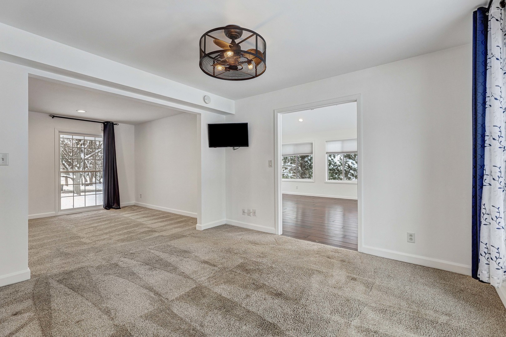 3901 Weathervane Lane Crystal Lake, IL 60012 - Photo 8 of 36 a view of an empty room with a window and kitchen view