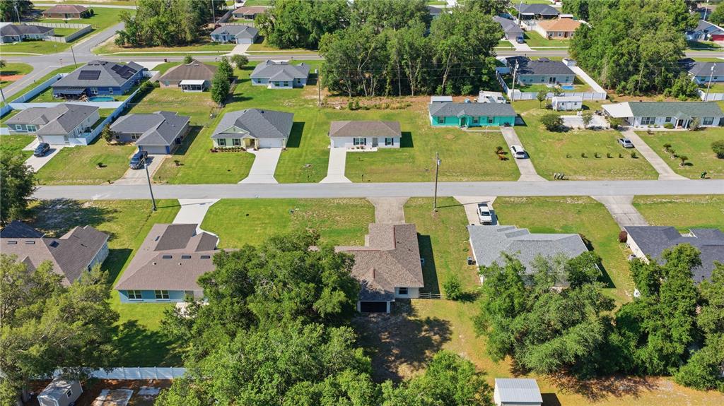 3959 Southwest 129th Street Ocala, FL 34473 - Photo 25 of 27 an aerial view of residential houses with outdoor space and parking