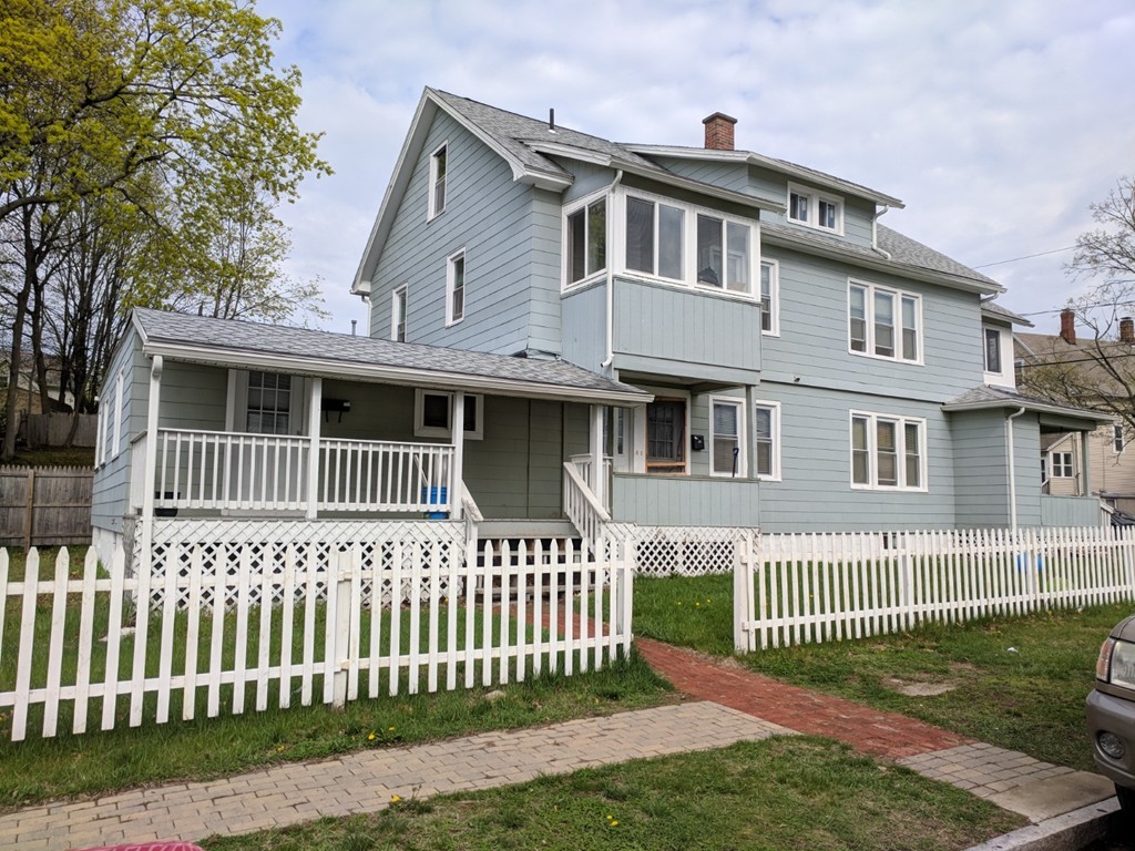 175-177 Corthell Street Springfield, MA 01151 - Photo 1 of 12 a front view of a house with a garden