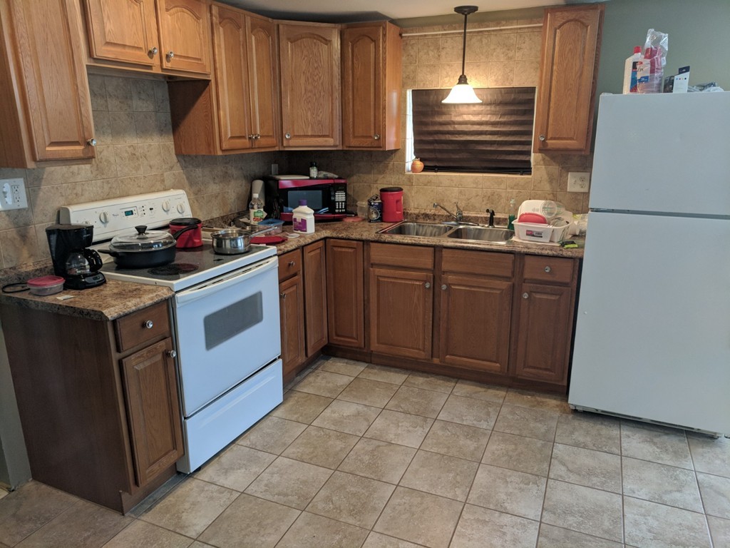 175-177 Corthell Street Springfield, MA 01151 - Photo 3 of 12 a kitchen with a cabinets and appliances