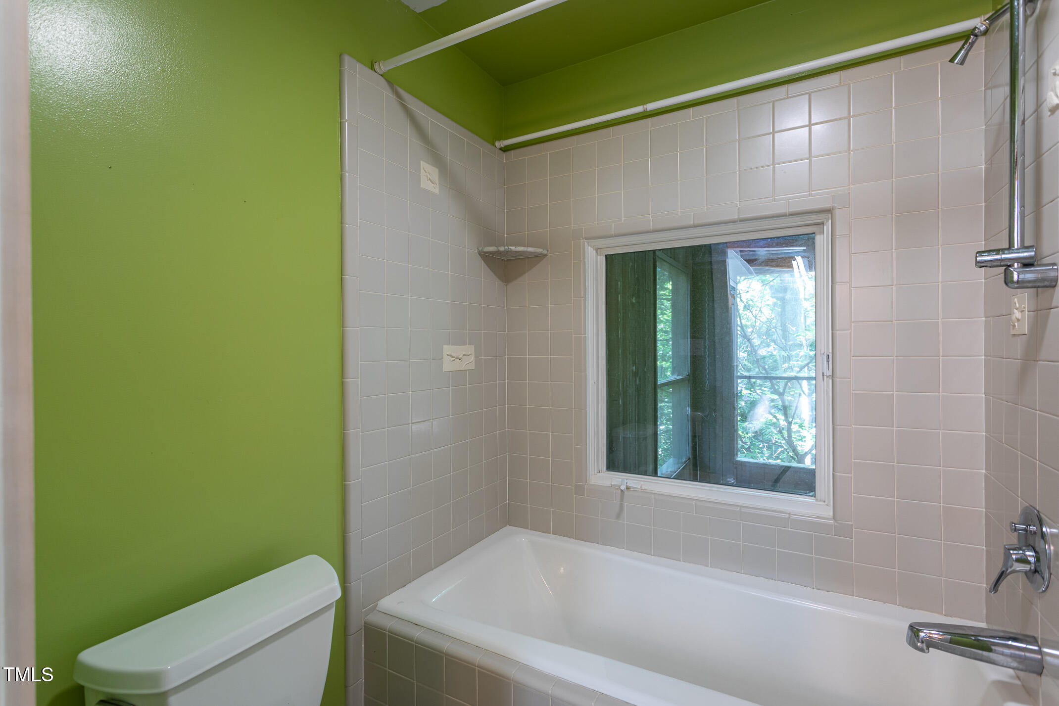 820 Runnymede Road Raleigh, NC 27607 - Photo 27 of 43 deep bathtub -- casement window opens to two story screened porch