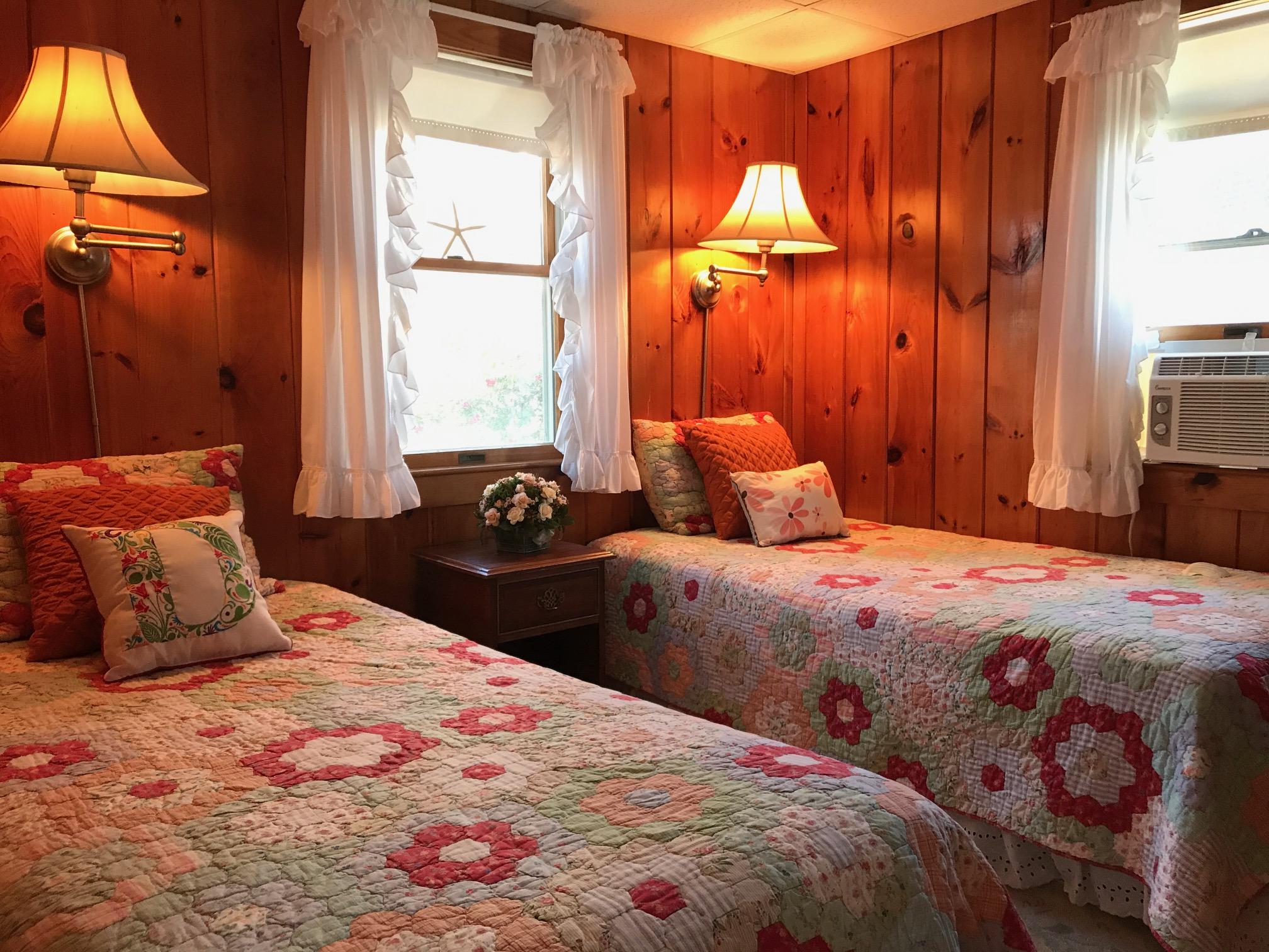 140 Old Wharf Road, Unit 2 Dennis Port, MA 02639 - Photo 12 of 22 a bedroom with a bed and a window