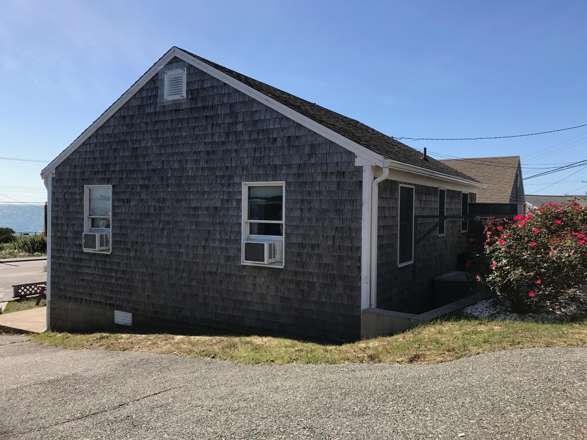 140 Old Wharf Road, Unit 2 Dennis Port, MA 02639 - Photo 17 of 22 a front view of a house