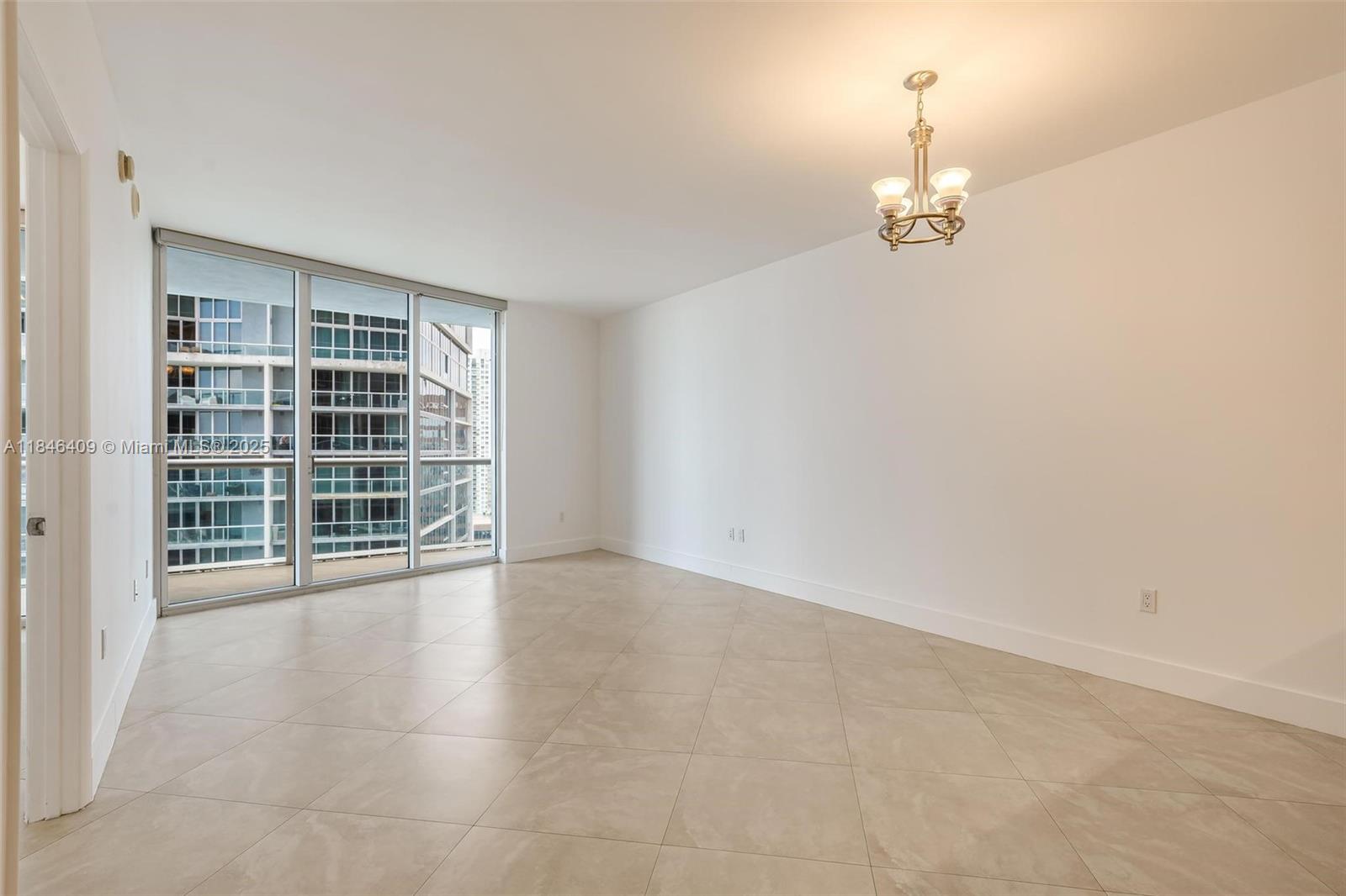 475 Brickell Avenue, Unit 3811 Miami, FL 33131 - Photo 11 of 21 an empty room with windows