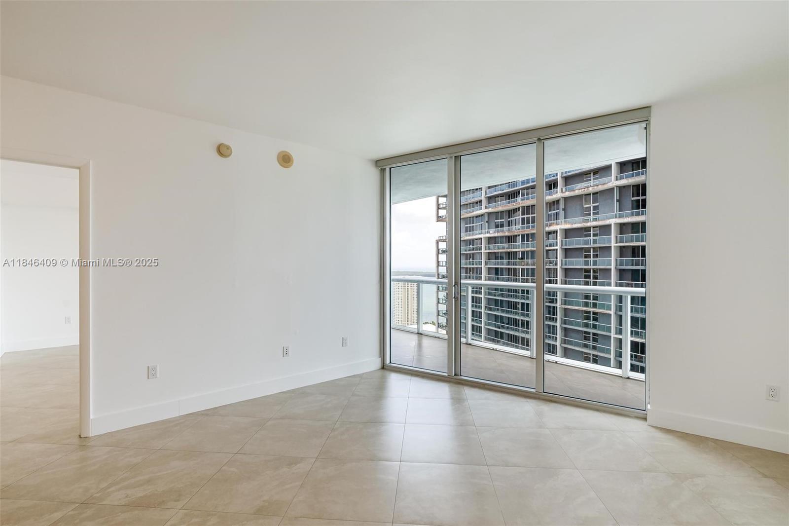 475 Brickell Avenue, Unit 3811 Miami, FL 33131 - Photo 12 of 21 a view of an empty room with a window