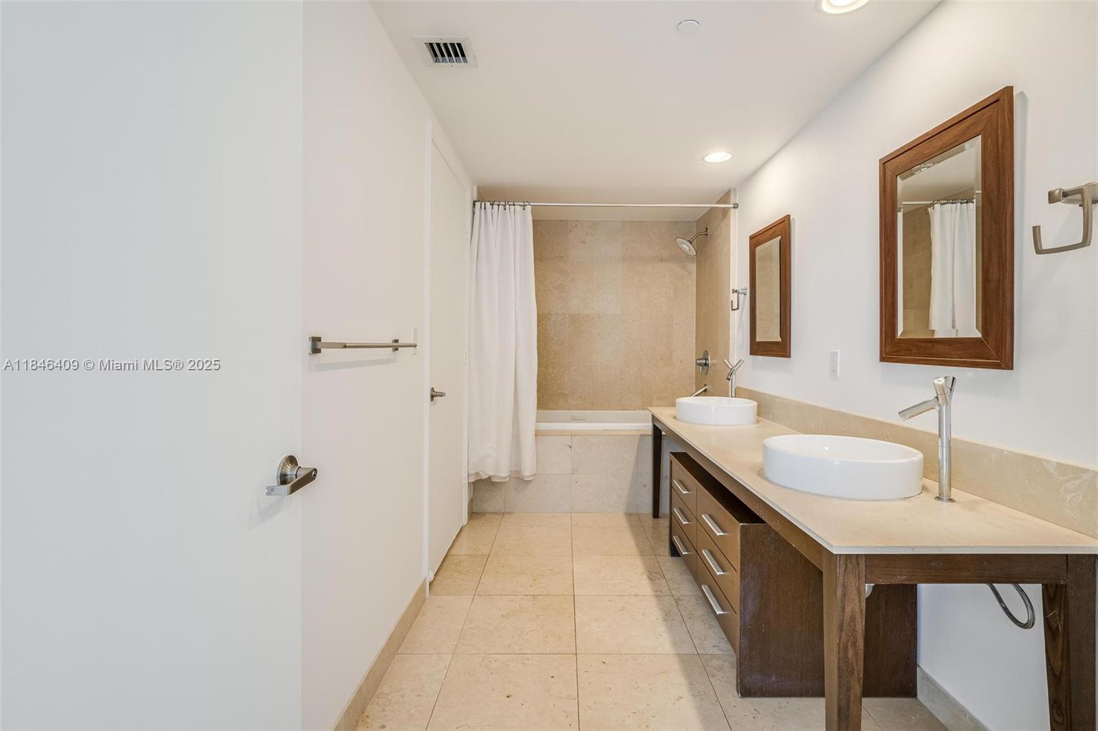 475 Brickell Avenue, Unit 3811 Miami, FL 33131 - Photo 15 of 21 a spacious bathroom with a double vanity sink and mirror