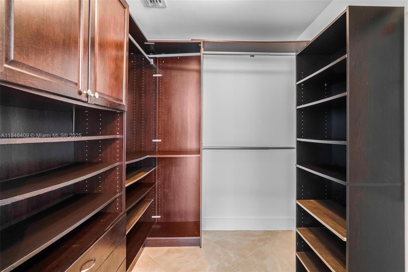 475 Brickell Avenue, Unit 3811 Miami, FL 33131 - Photo 19 of 21 a view of walk in closet with empty racks