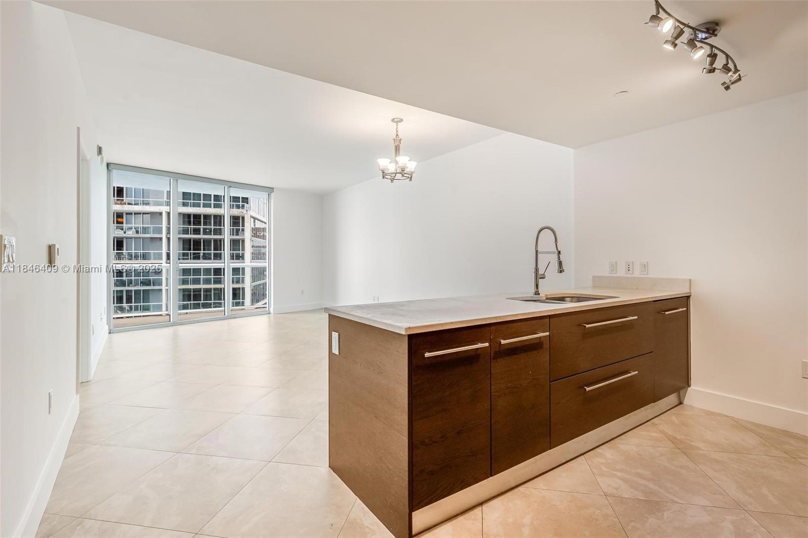 475 Brickell Avenue, Unit 3811 Miami, FL 33131 - Photo 8 of 21 a kitchen with a cabinets and window