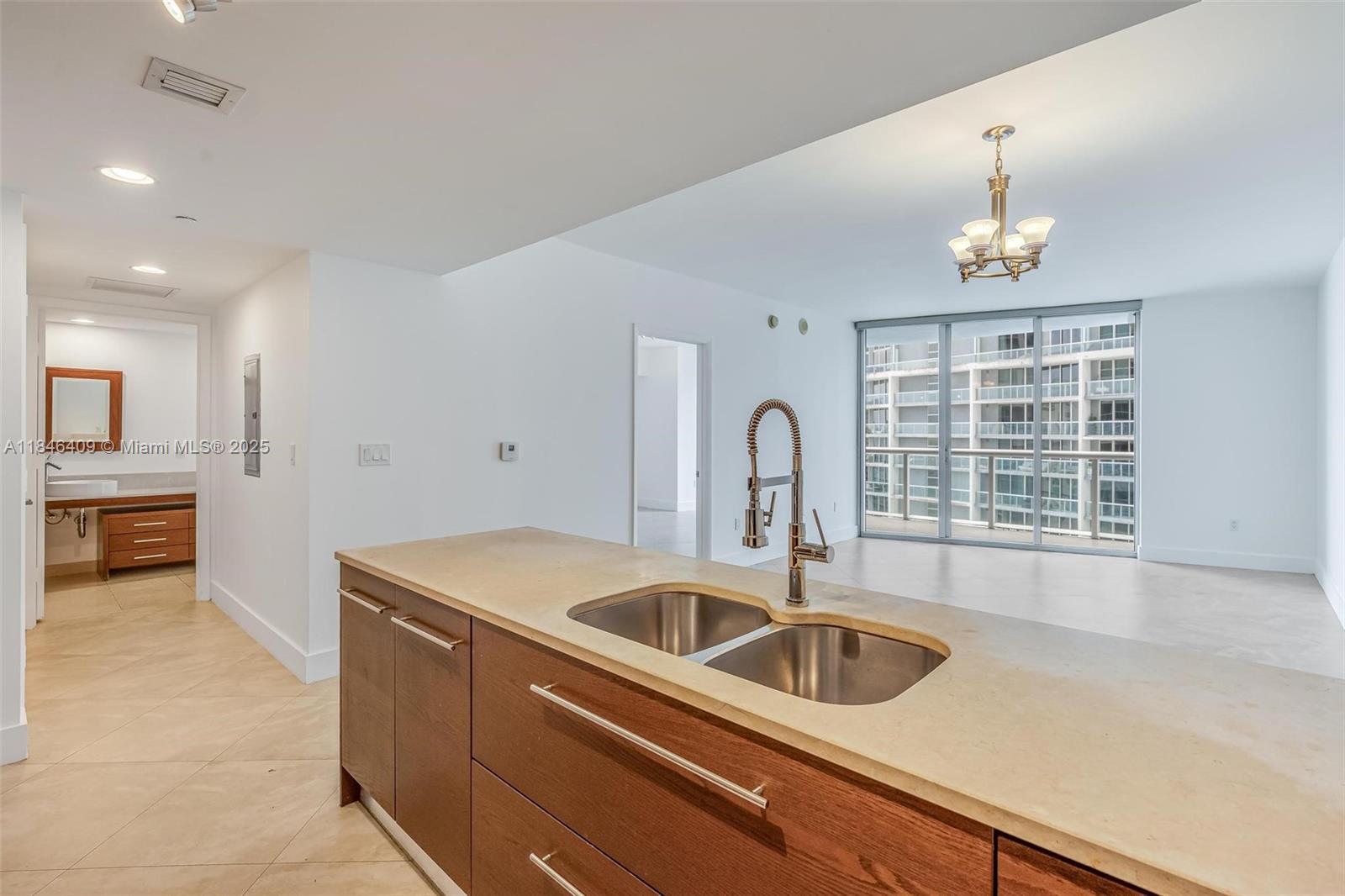 475 Brickell Avenue, Unit 3811 Miami, FL 33131 - Photo 9 of 21 a kitchen that has a sink and a stove