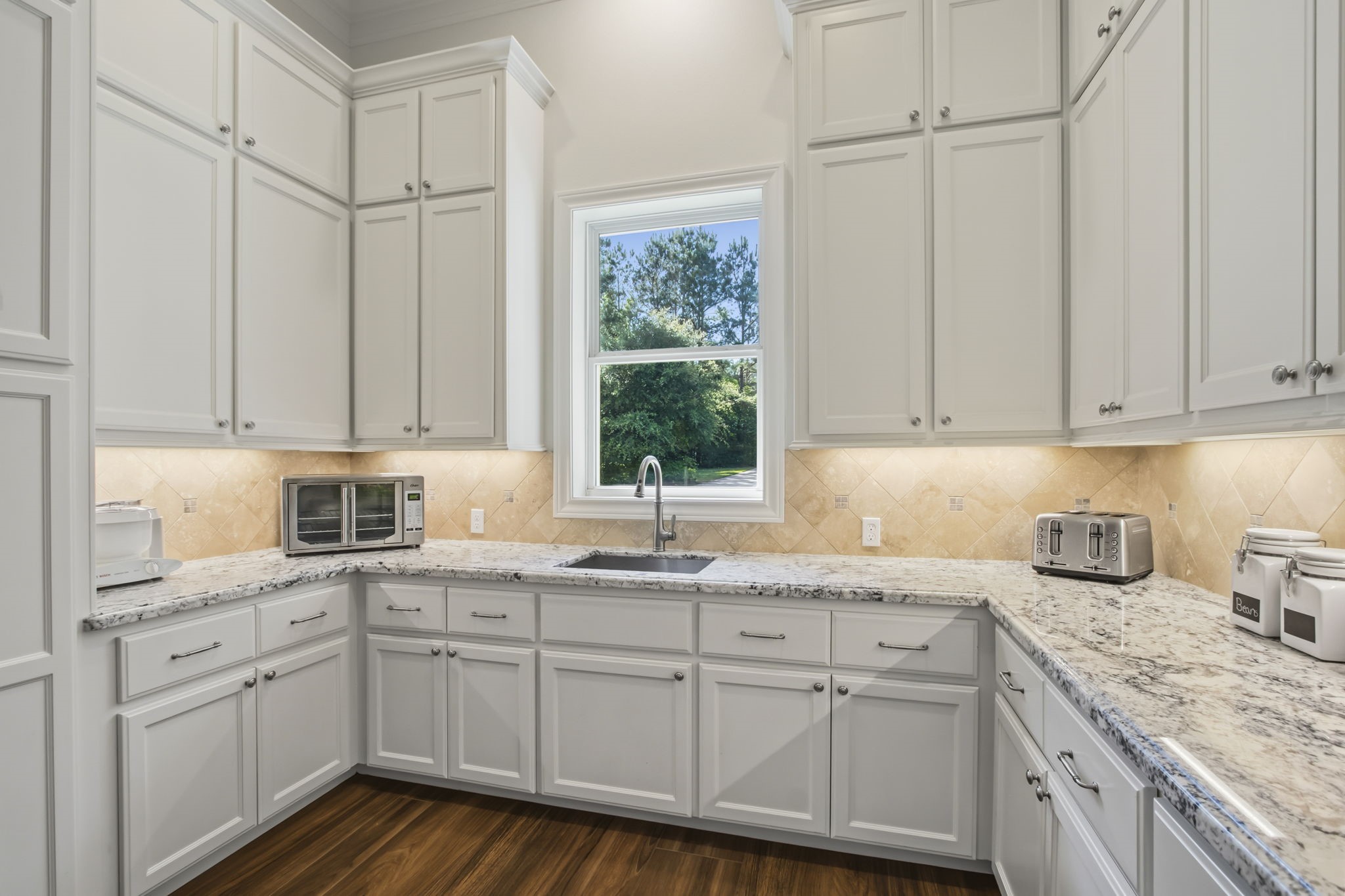 36702 Deer Valley Magnolia, TX 77355 - Photo 13 of 46 a kitchen with white cabinets and white appliances
