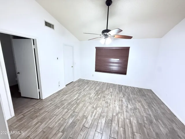 a view of a backyard with a patio