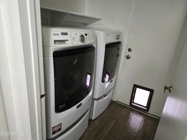a utility room with washer and dryer
