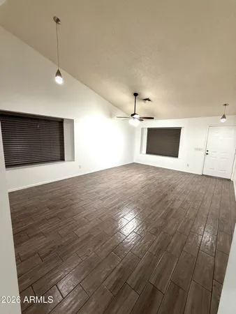 a view of a livingroom with wooden floor