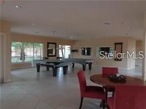 a dining room with wooden floor and a table