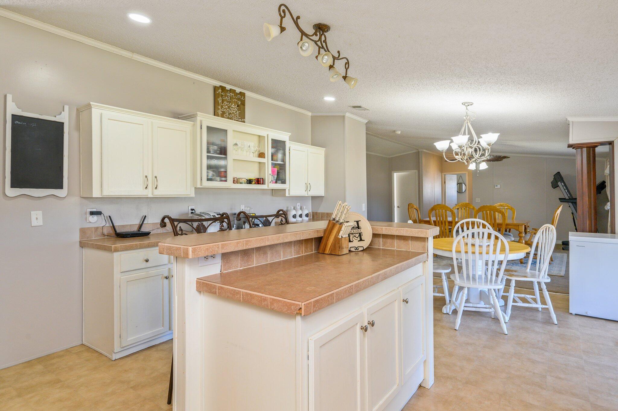 1078 Wallace Road DeFuniak Springs, FL 32433 - Photo 3 of 46 a view of a kitchen counter space a sink stainless steel appliances and cabinets