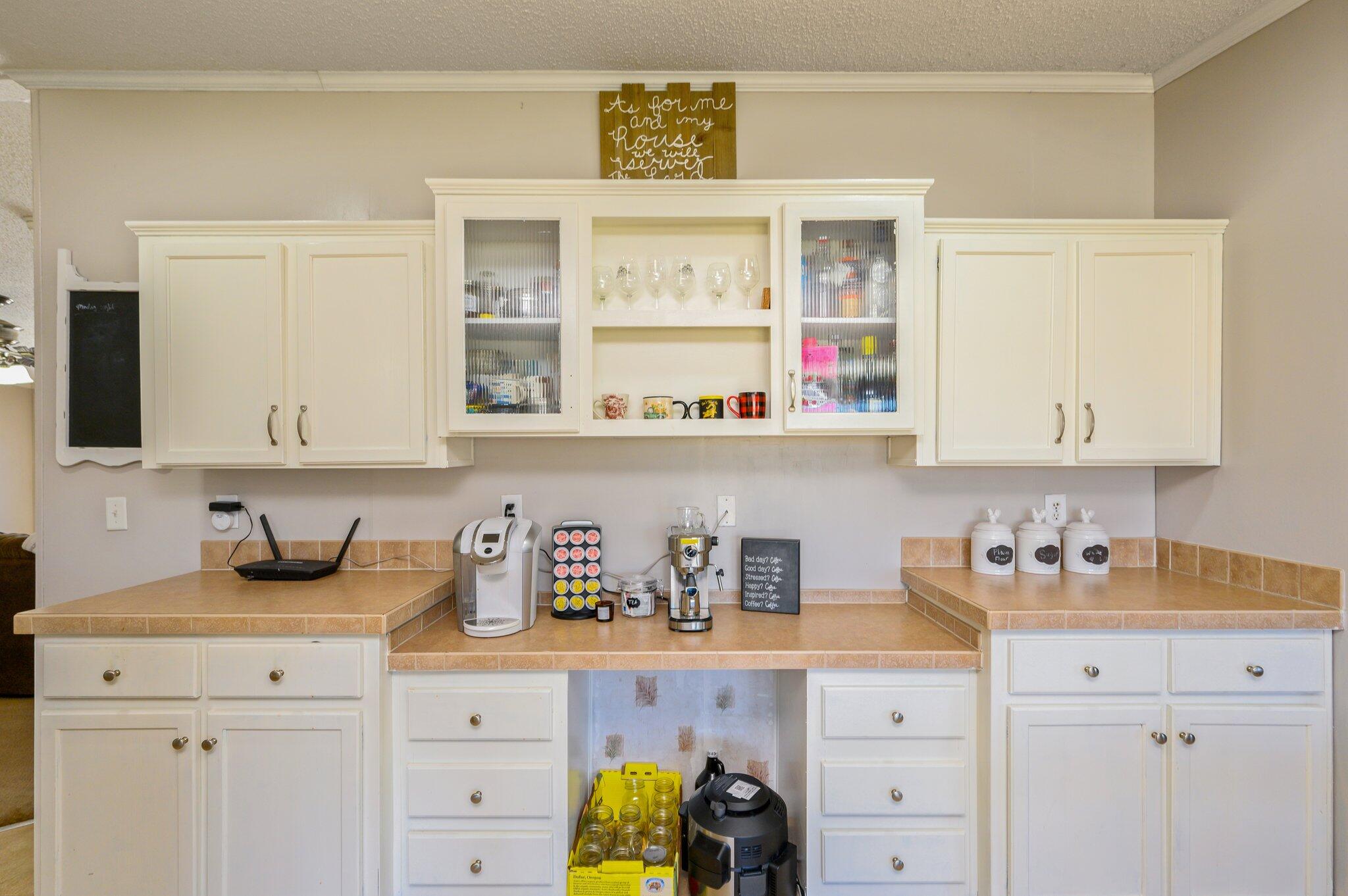 1078 Wallace Road DeFuniak Springs, FL 32433 - Photo 4 of 46 a kitchen with cabinets appliances and a window