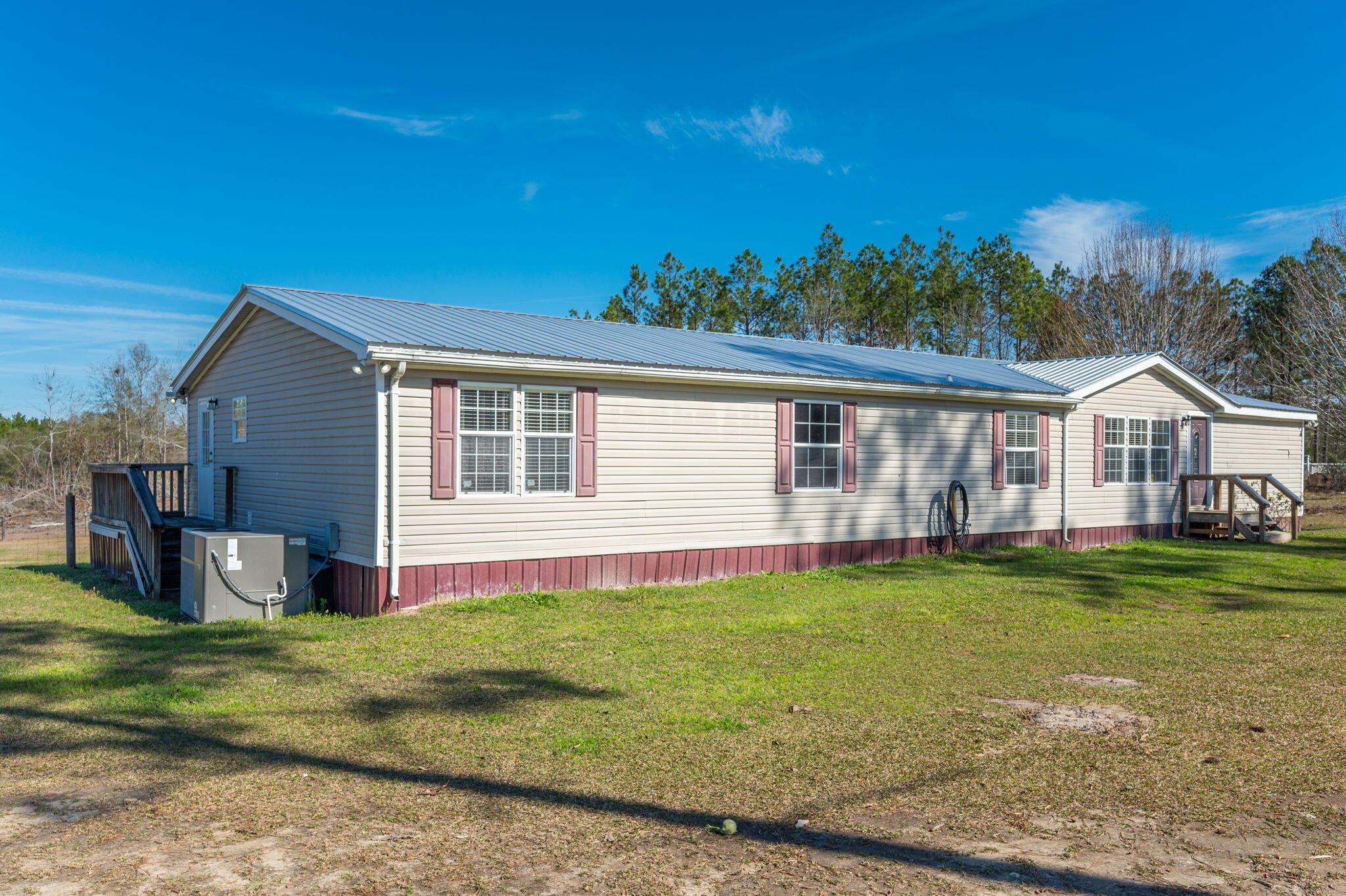 1078 Wallace Road DeFuniak Springs, FL 32433 - Photo 46 of 46 a view of a house with a yard and sitting area