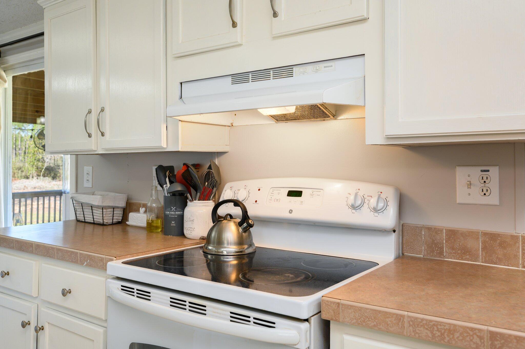 1078 Wallace Road DeFuniak Springs, FL 32433 - Photo 5 of 46 a kitchen with a stove and a sink