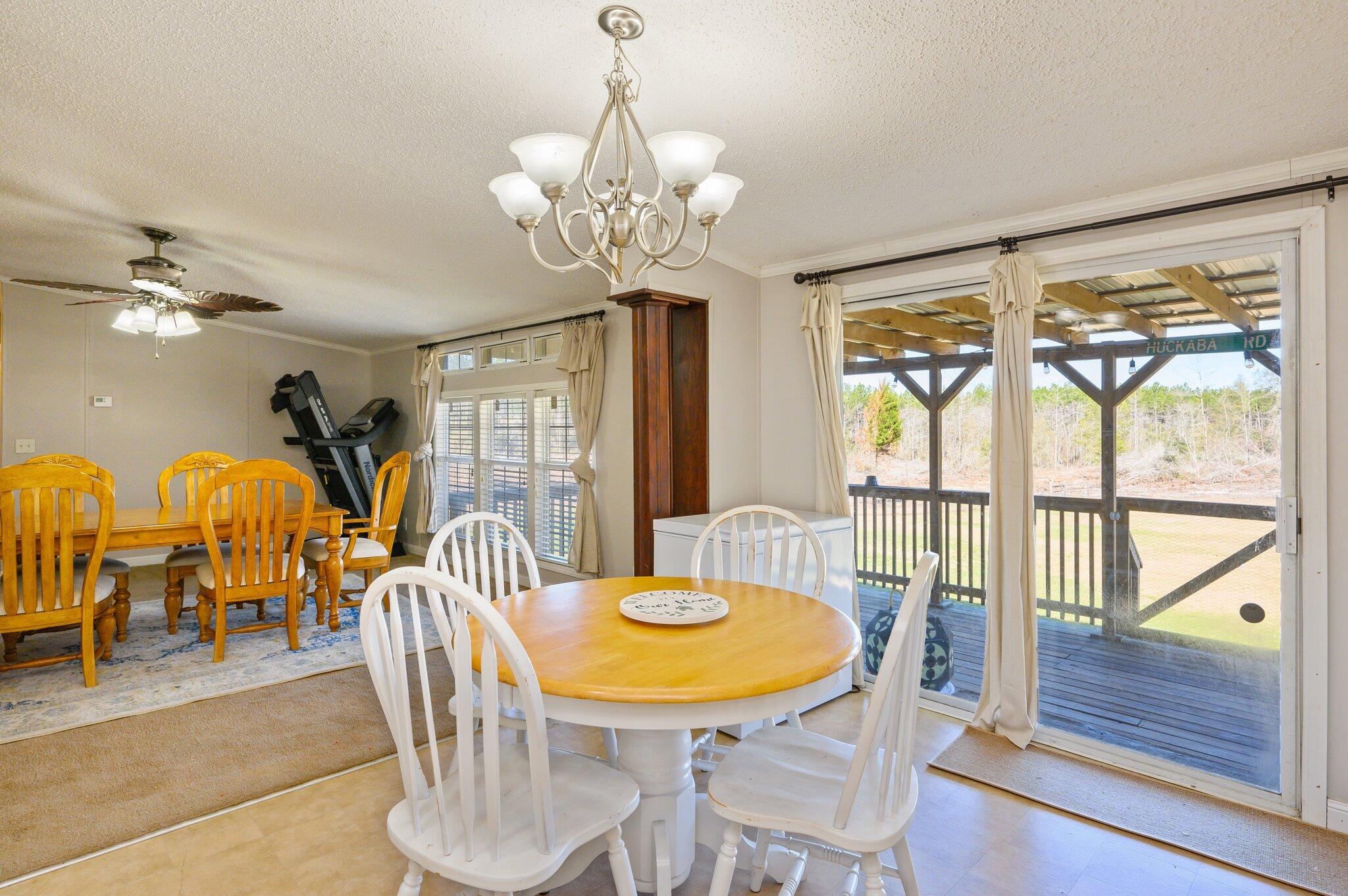 1078 Wallace Road DeFuniak Springs, FL 32433 - Photo 7 of 46 a view of a dining room with furniture window and outside view