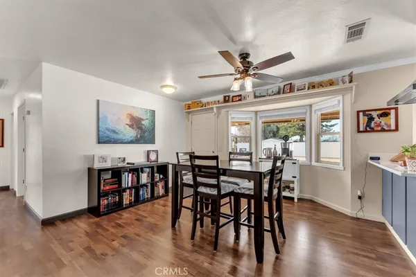 a kitchen with stainless steel appliances granite countertop a stove and a refrigerator