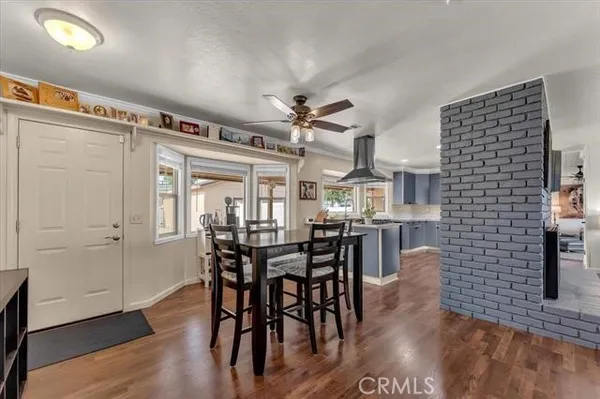 a kitchen with granite countertop stainless steel appliances a sink and cabinets
