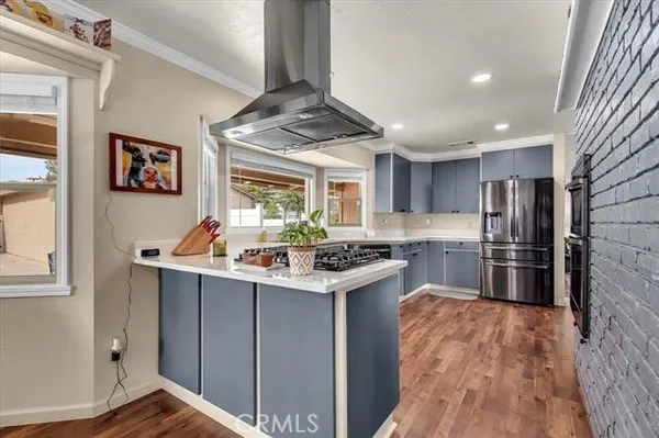 a kitchen with a refrigerator and a sink
