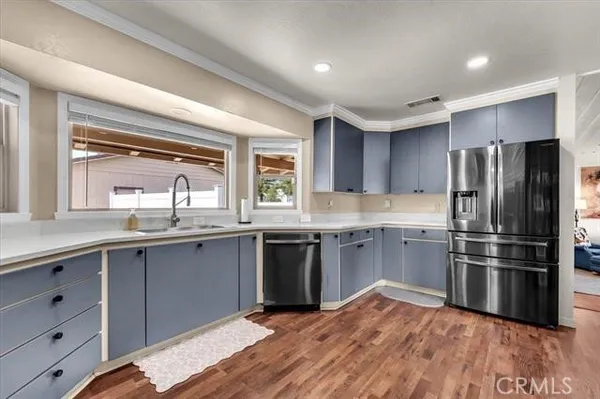 a kitchen with stainless steel appliances granite countertop a stove and a sink