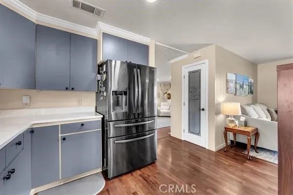 a kitchen with a sink and large window