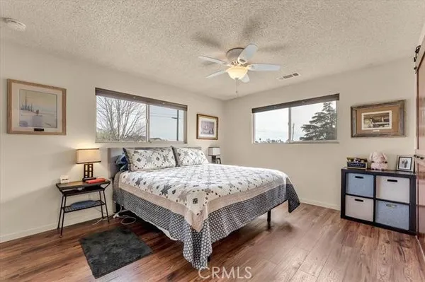 a bedroom with a bed and a dresser in it