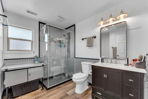 an aerial view of a house with a garden and lake view