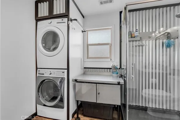 a view of a house with swimming pool and a yard