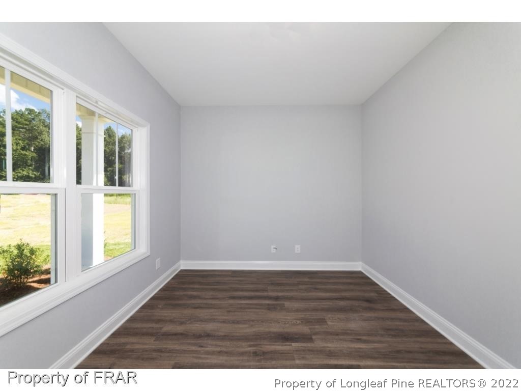 5216 Bree Bridge Road Hope Mills, NC 28348 - Photo 4 of 28 a view of an empty room and window
