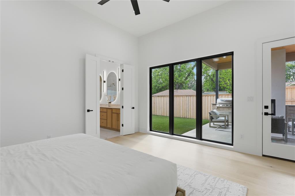 6038 Prospect Avenue Dallas, TX 75206 - Photo 18 of 40 Room featuring light wood-finish flooring, a contemporary ceiling fan, and white walls