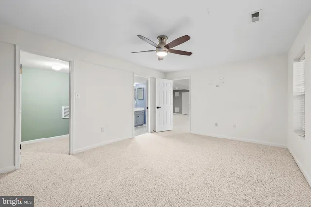 an aerial view of a house with a yard swimming pool and lake view
