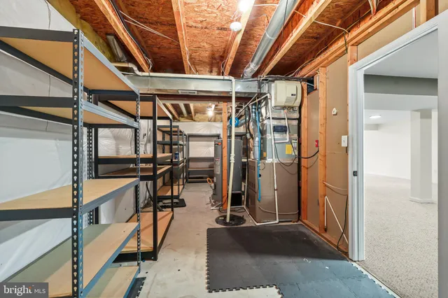 a living room with furniture a window and a fireplace