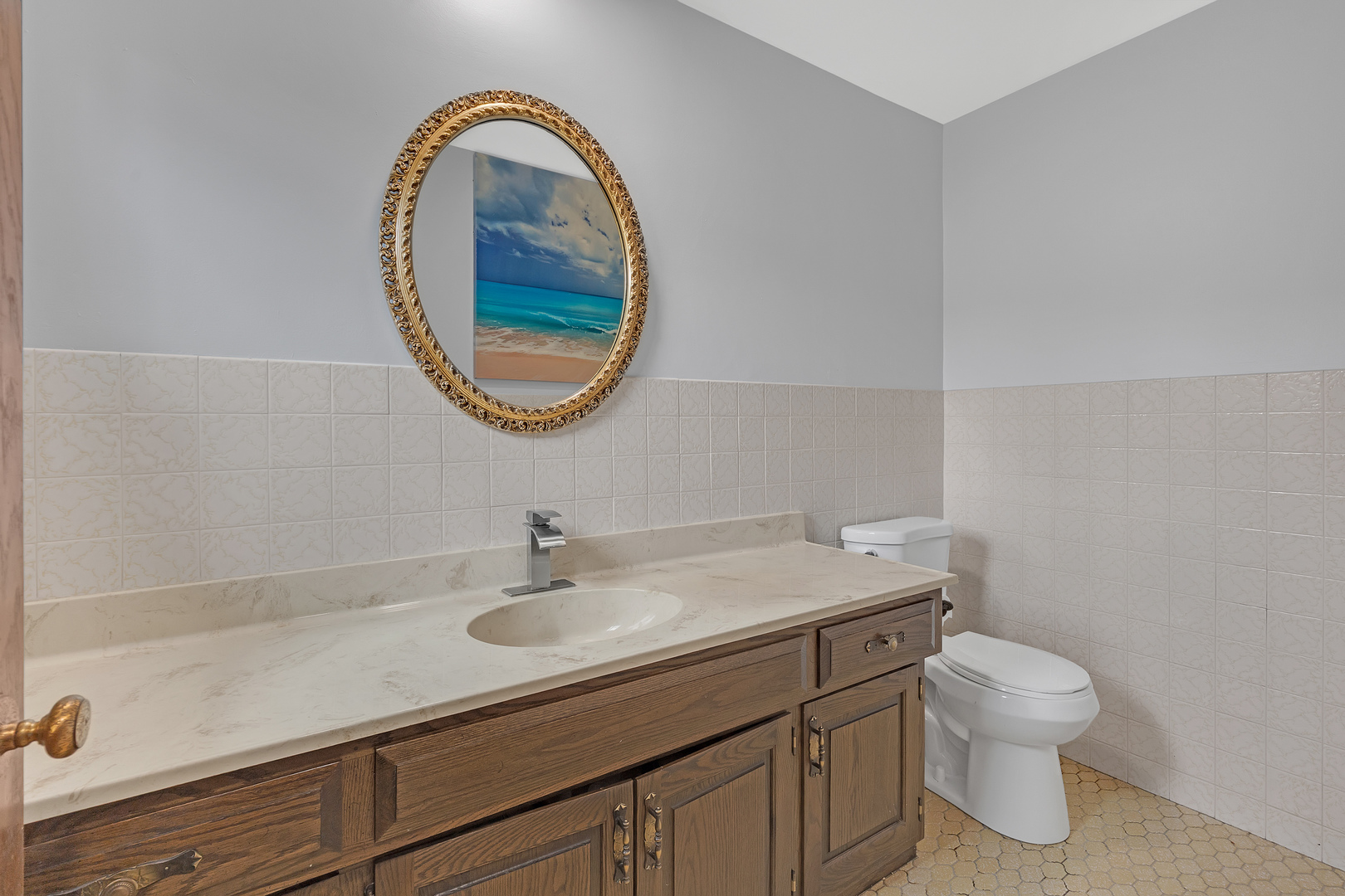 11020 Raleigh Street Westchester, IL 60154 - Photo 14 of 27 a bathroom with a sink a toilet and a mirror