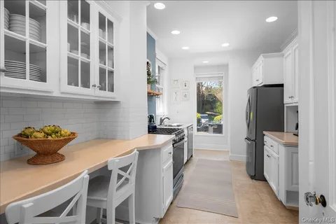 a kitchen with a sink and refrigerator