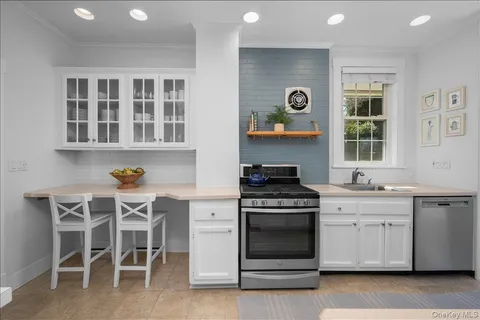 a kitchen with a stove and a microwave