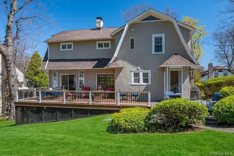 a view of backyard with sitting area