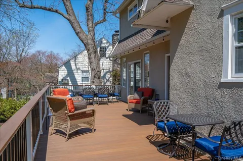 a outdoor living space with patio furniture and a fireplace