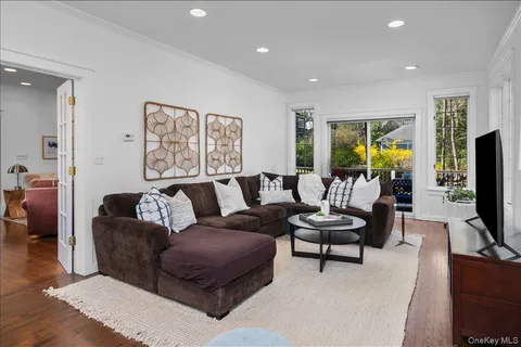a living room with furniture tv and a flat screen tv