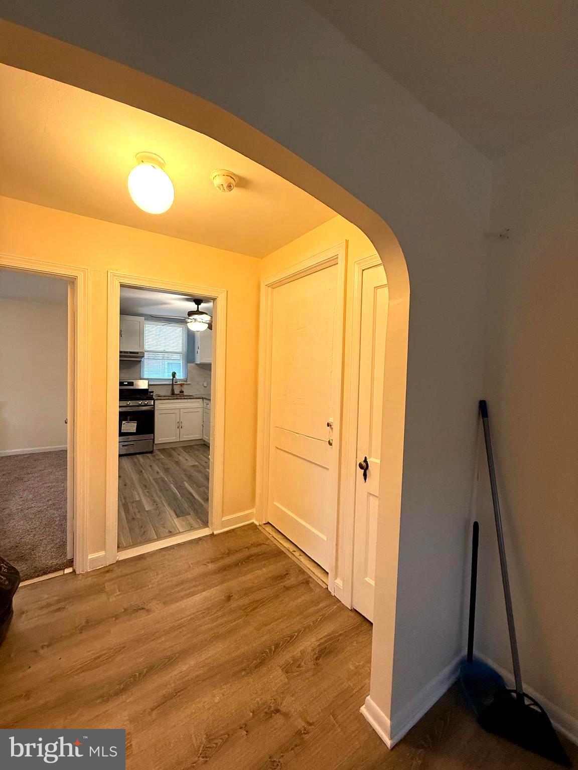 4401 Bleigh Avenue, Unit 2 Philadelphia, PA 19136 - Photo 9 of 25 a view of a hallway to a livingroom with wooden floor and furniture