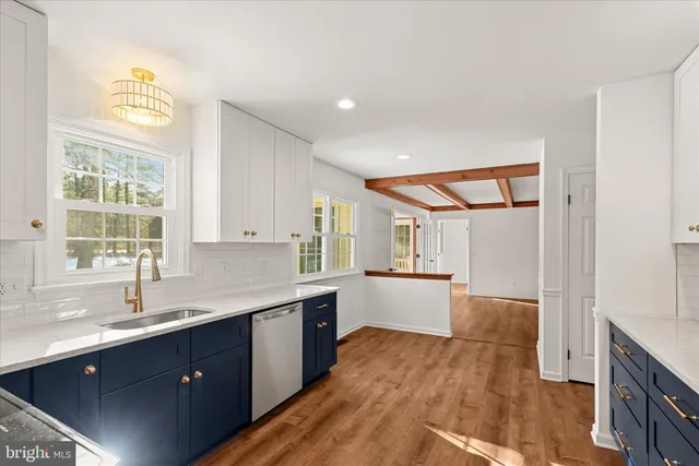 a kitchen with a sink and wooden cabinets