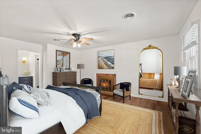 a bed room with a bed and a mirror