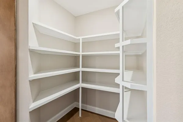 a view of an empty walk in closet