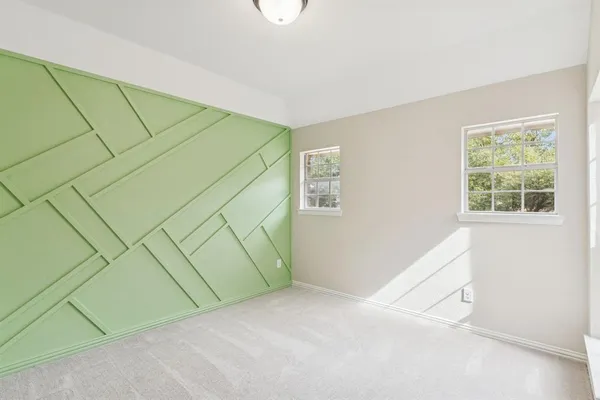 a view of an empty room and a window