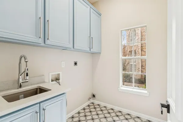 a kitchen with a sink and cabinets