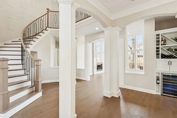 a view of an entryway with wooden floor and windows